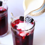 Blackberry infused iced earl grey tea with a splash of cream