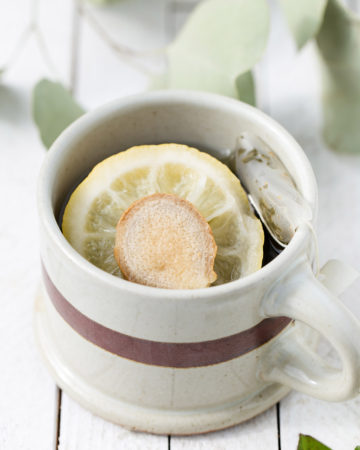 A hot mug of ginger lemon green tea