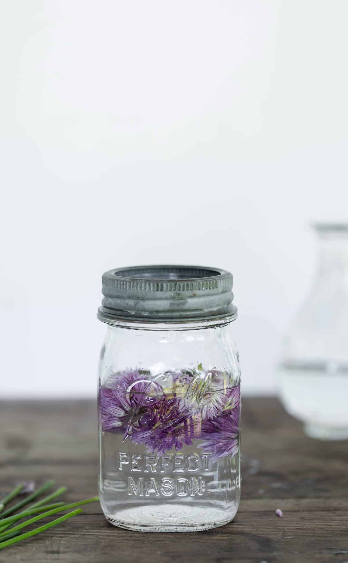 To make pickled chive blossoms simply add steeped blossoms to a small jar and fill with a mixture of vinegar, water, sugar and salt. Refrigerate and consume pickled chive blossoms within a week.